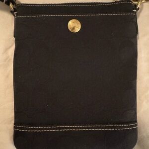 Coach Black Crossbody Bag with Gold Accents, stitching, adjustable strap.